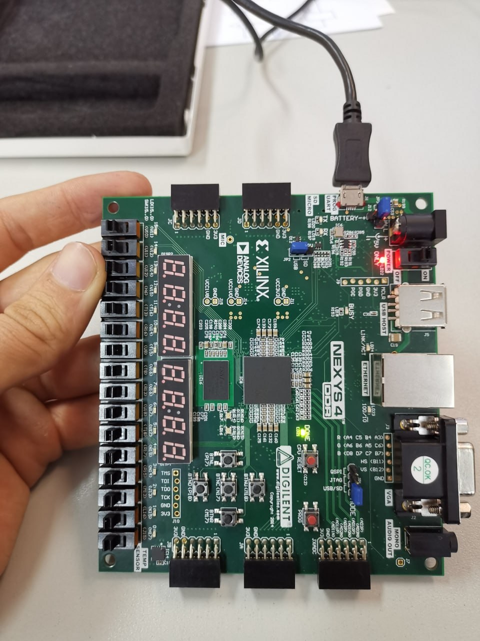 Digilent Nexys 4 DDR FPGA board with the Xilinx chip, seven-segment display and slide switches