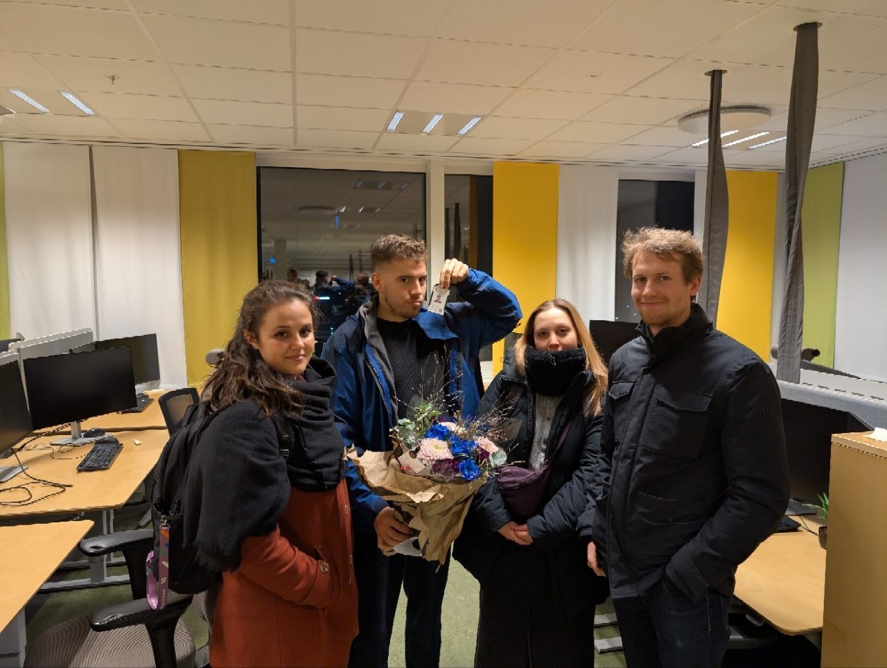 Farewell moment with flowers and colleagues