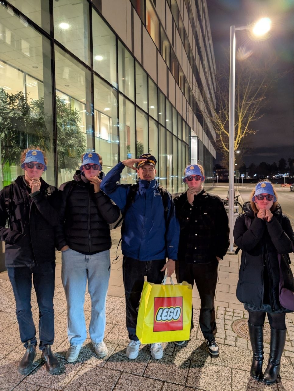 Team night out with bucket hats and a LEGO bag