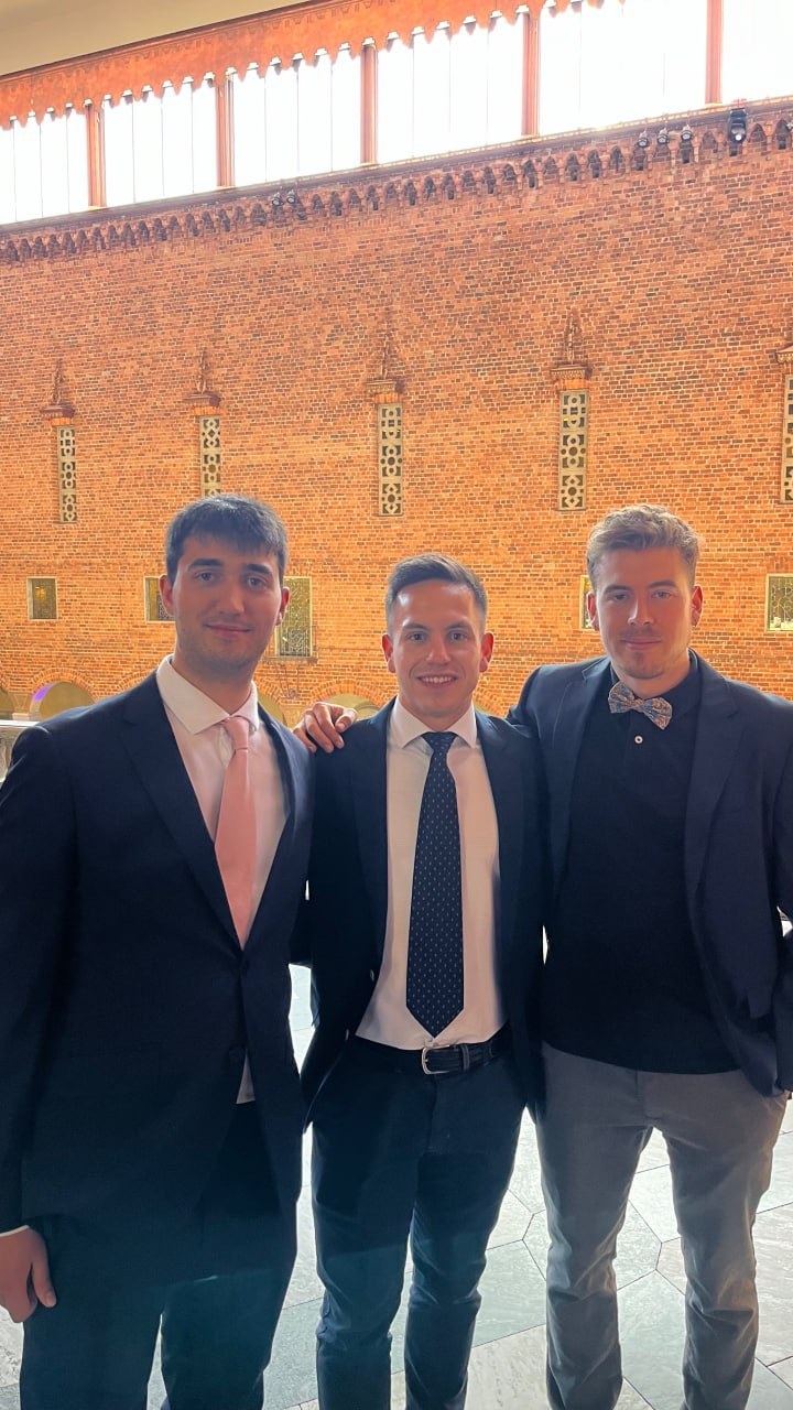 Friends in suits inside the City Hall