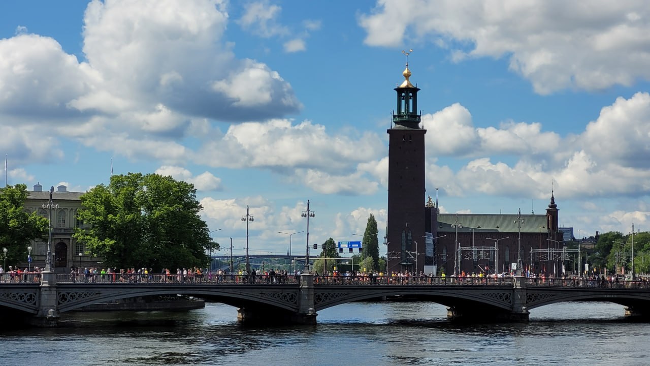 The Stockholm City Hall from the bridge, with the crowd on graduation day