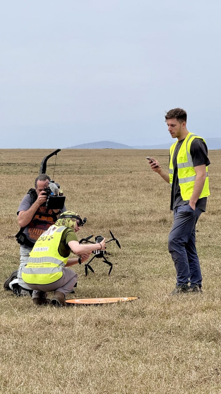 Operating drone swarm in SDU WildDrone vest on the savannah