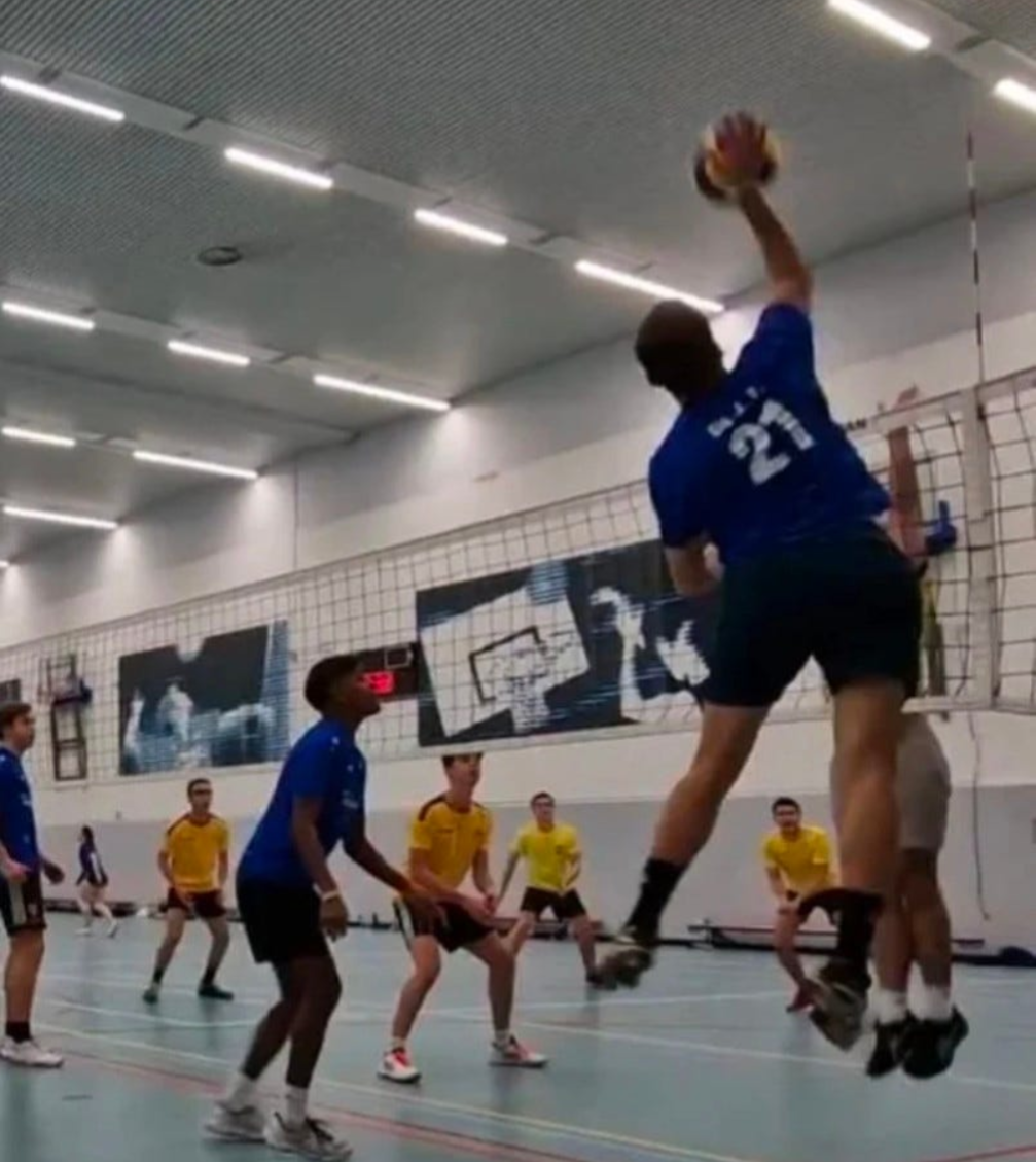 Alejandro playing volleyball